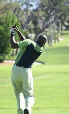 Man taking golf swing